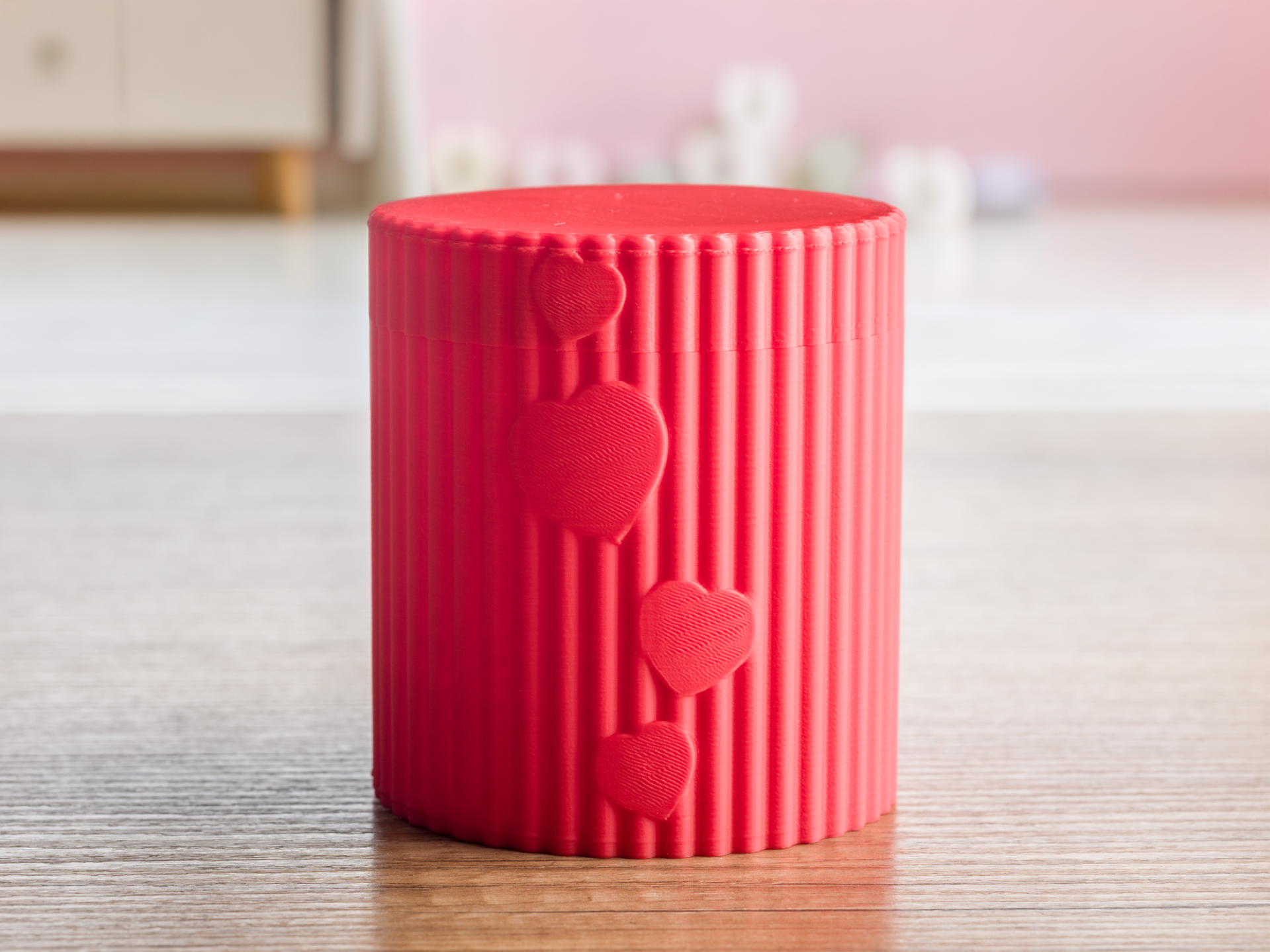 Container with embossed hearts.
