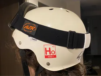 Helmet clip for ski goggles