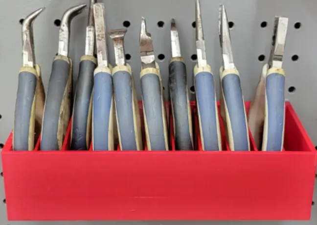 Mini plier holder for peg board