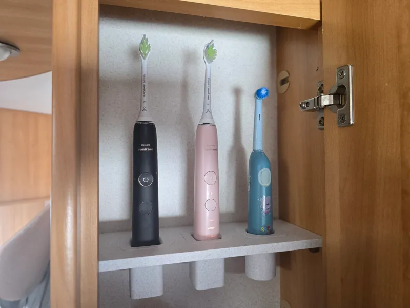 Toothbrush holder for caravan cabinet