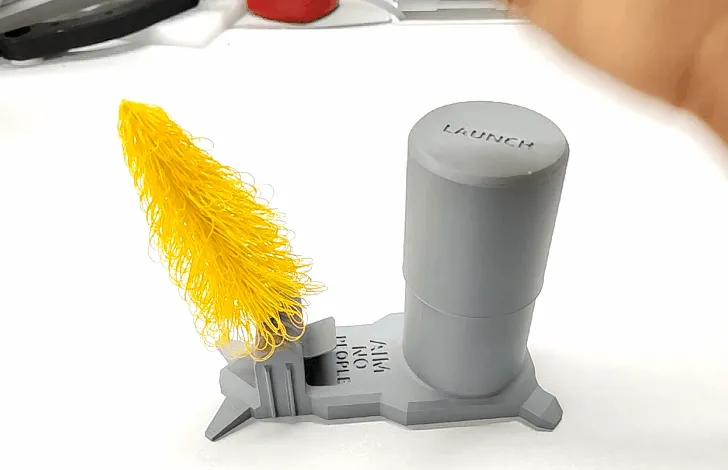 Lanceur à piston pour sapin de Noël