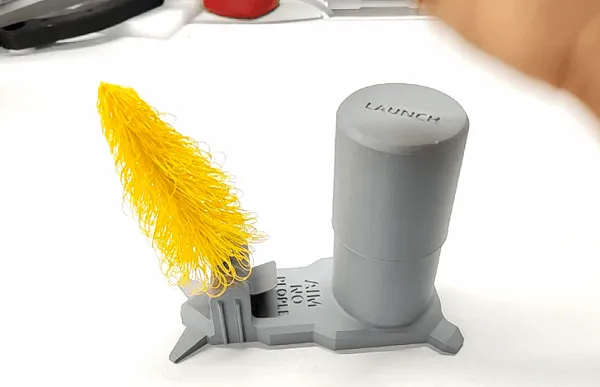 Lanceur à piston pour sapin de Noël