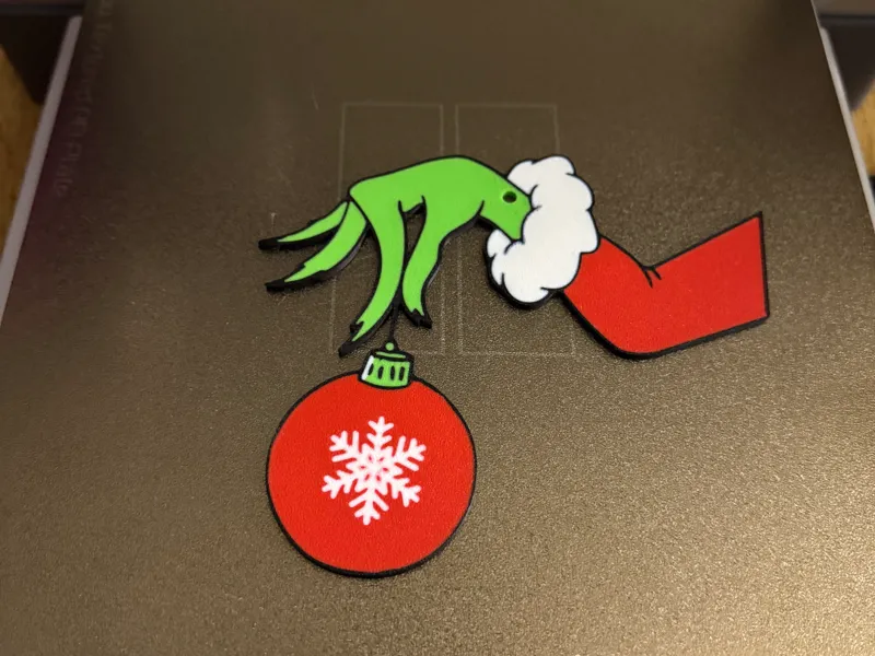 mano del grinch 