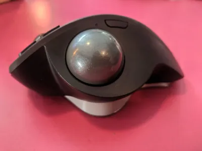 Logitech MX Ergo dongle and cleaning stick storage