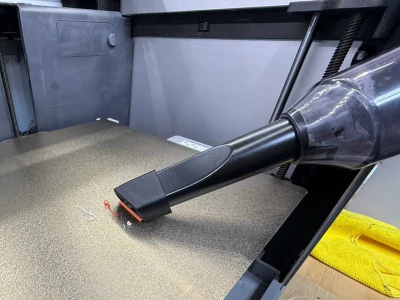 Plastic scraper attachment for handheld vacuum