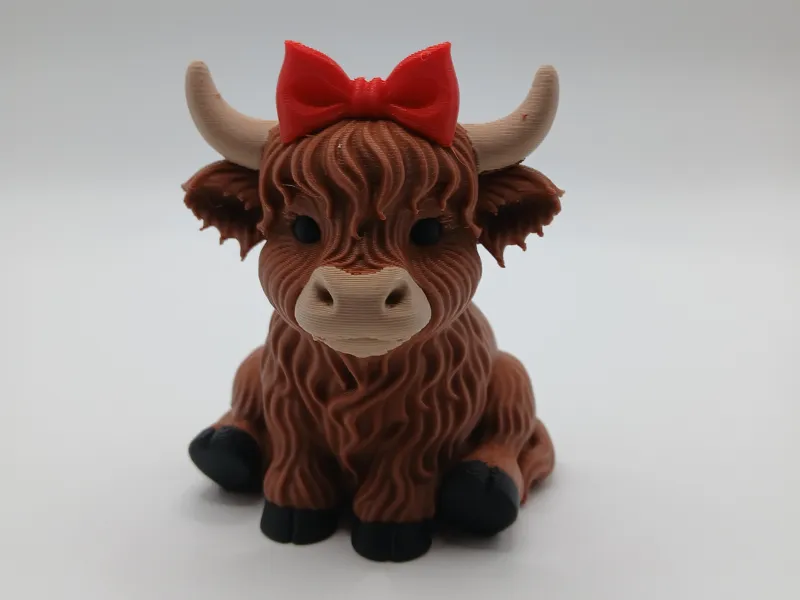 Highland Cow With Bow in Hair