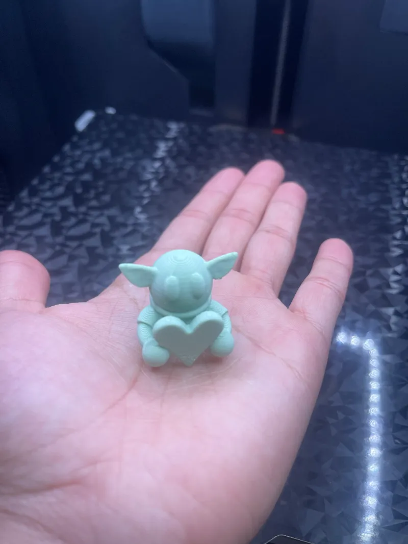 Cute Grogu holding a heart - The Mandalorian