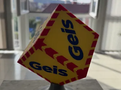 The logo of the Geis shipping company with a stand