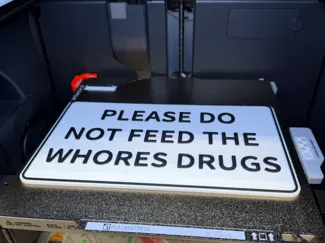 Please do not feed the whores drugs wall sign