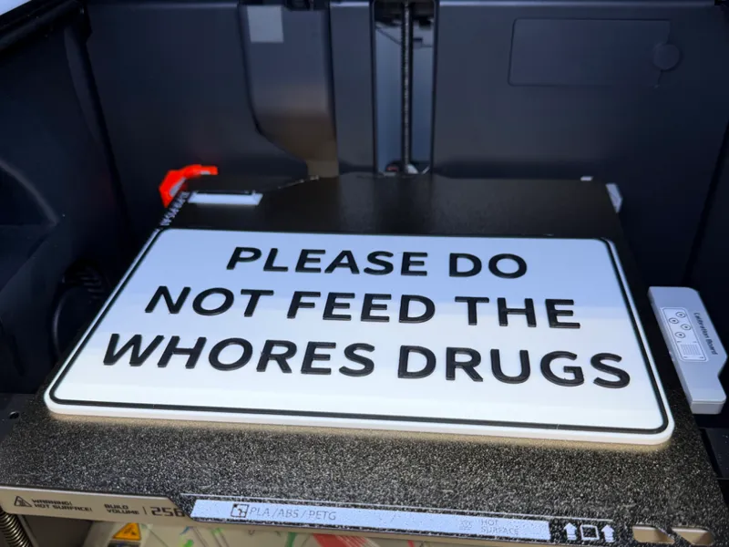 Please do not feed the whores drugs wall sign