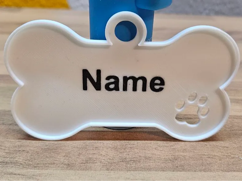 Hundemarke / Namensschild mit Pfote und Wandung
