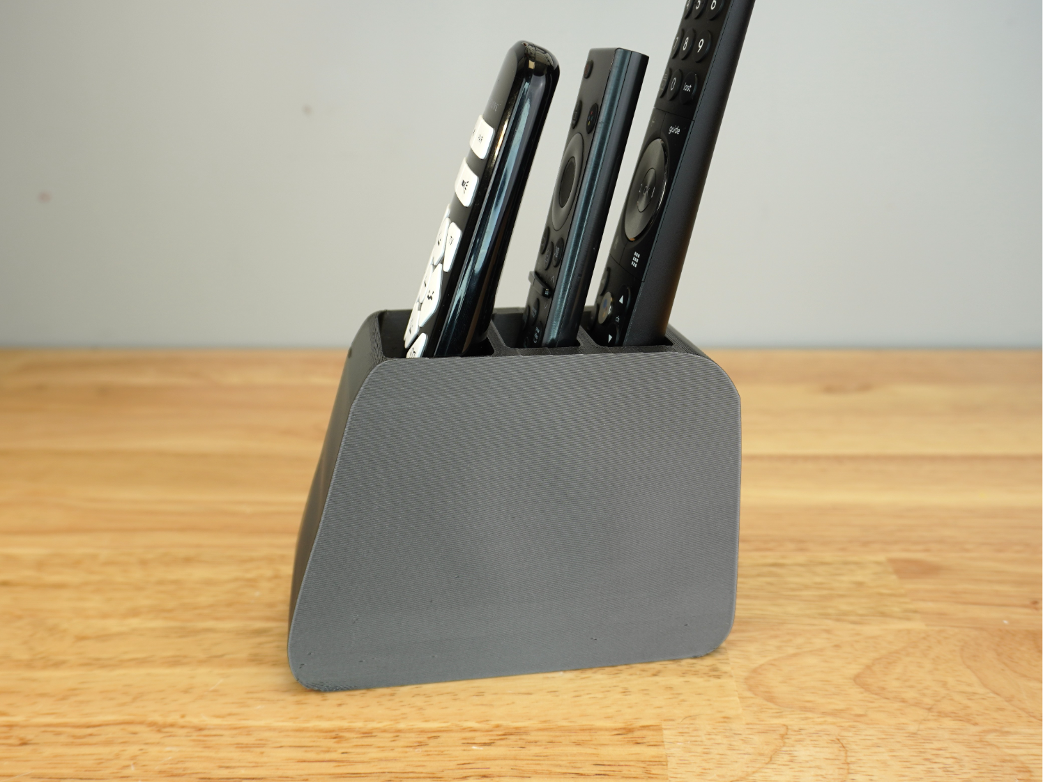 The Ultimate 3-Remote Stand - Sleek & Stable