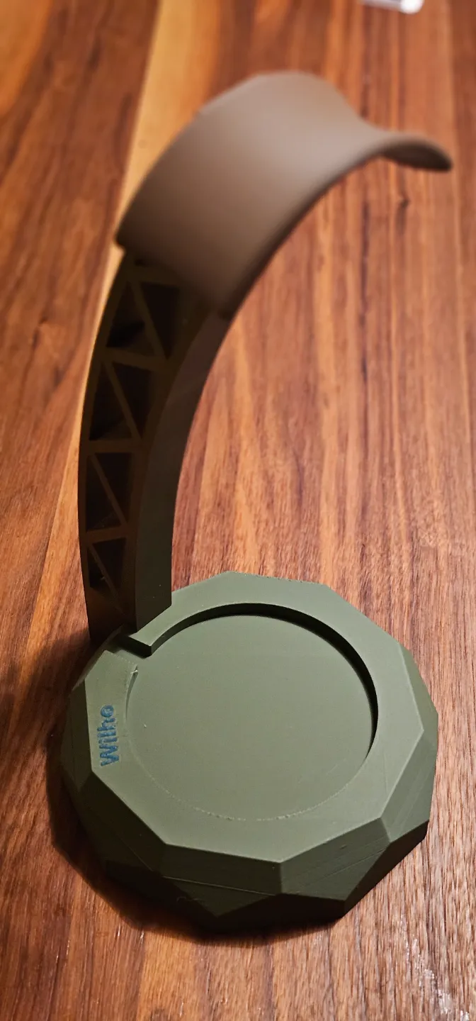 Headphone holder with wireless charging base