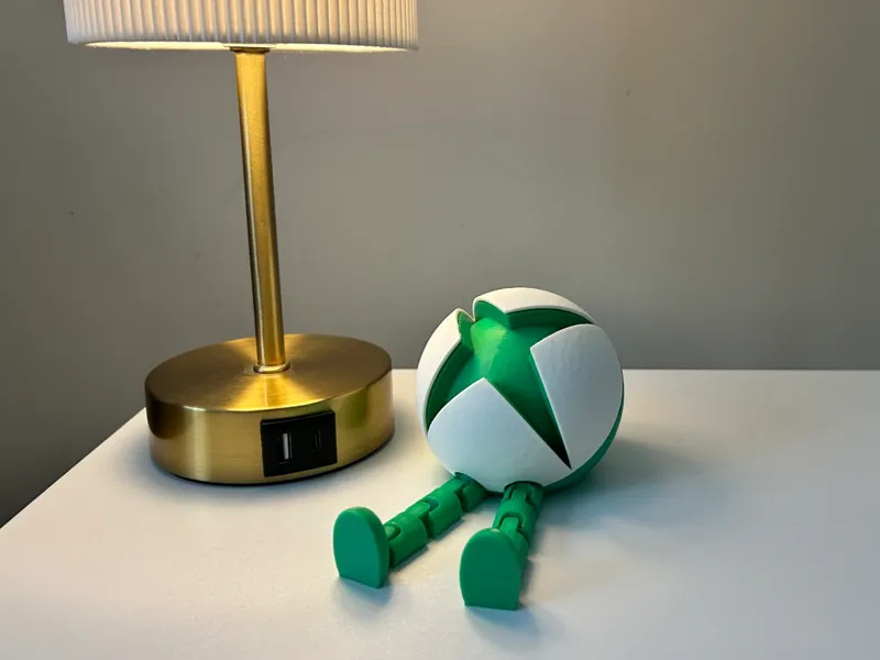 Articulated Xbox shelf buddy