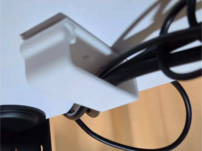 Desk/shelf cable grommet with quick connection