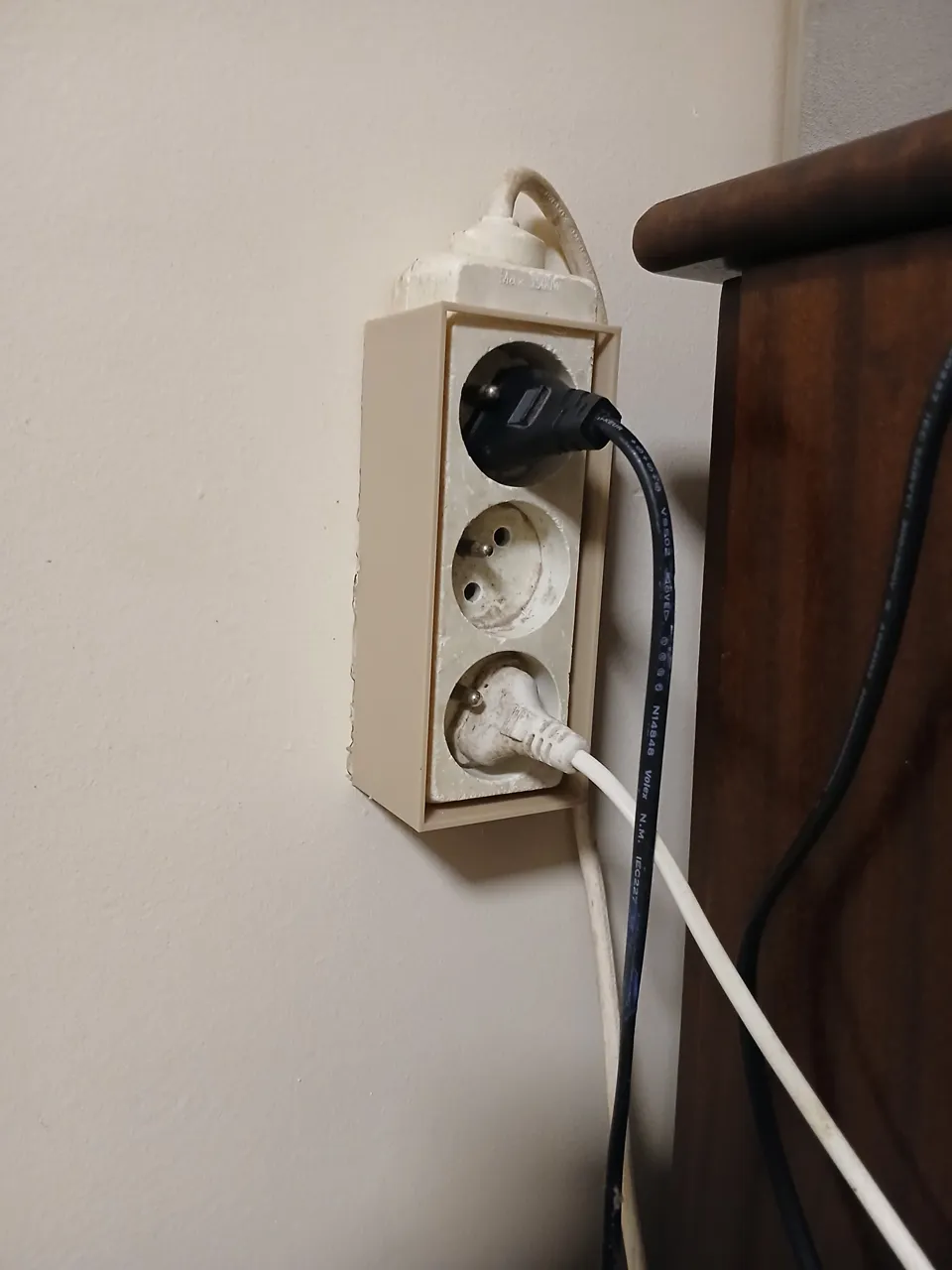 Wall-mounted extension cord holder view 4