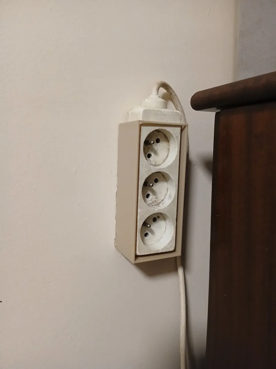 Wall-mounted extension cord holder view 3