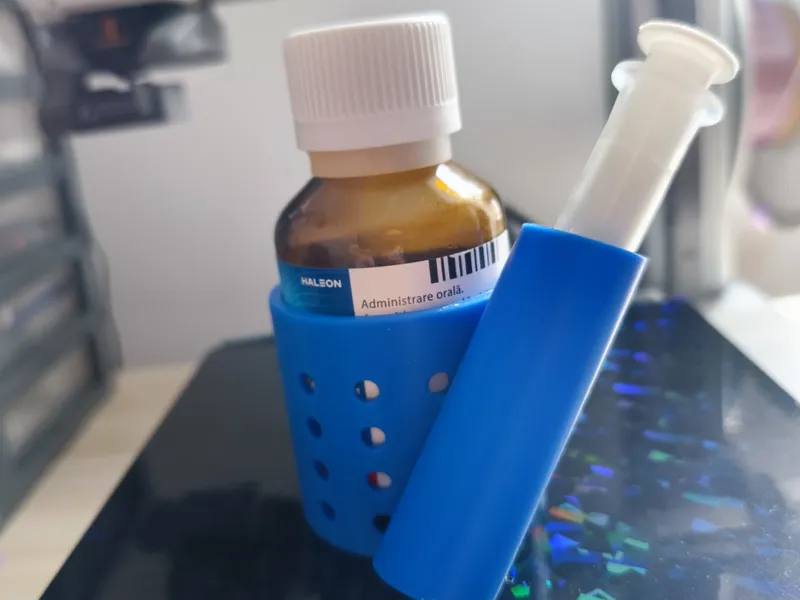Medicine syrup bottle and syringe holder