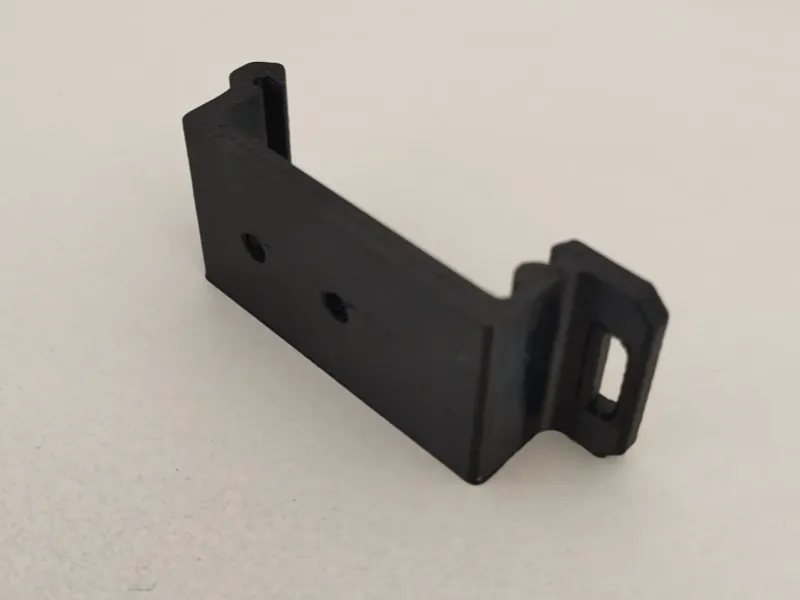 DIN rail support with screw holes