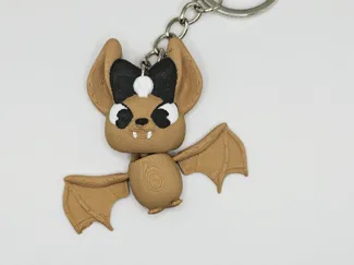 Bat with a bow keychain