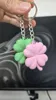 Cleaner front + back, new keychain hole design
