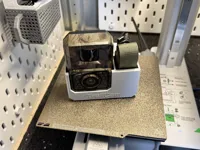 With storage for the band and cable.