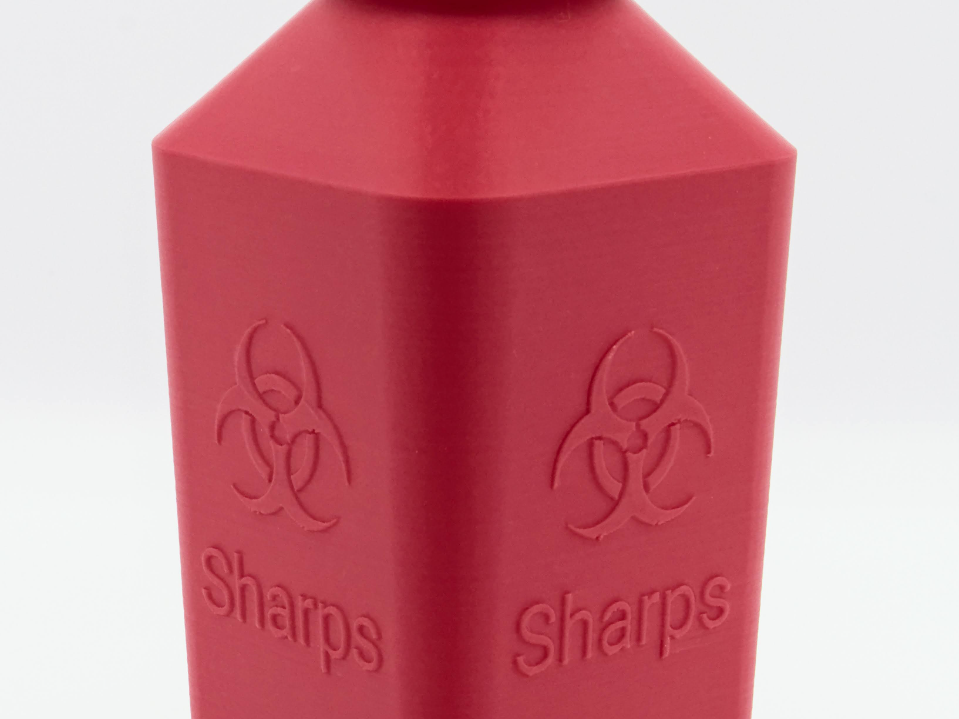 Sharps disposal container
