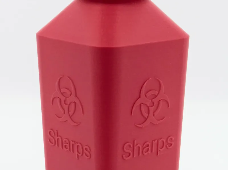 Sharps disposal container