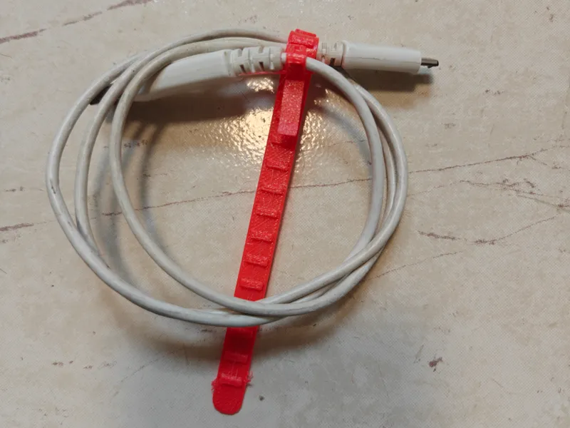 Cable tie with cable attachment