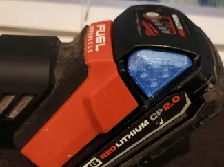 Milwaukee M18 battery release tab