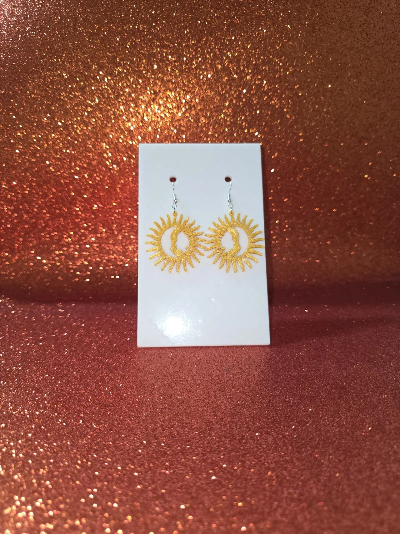 Moon and sun faces earrings view 2