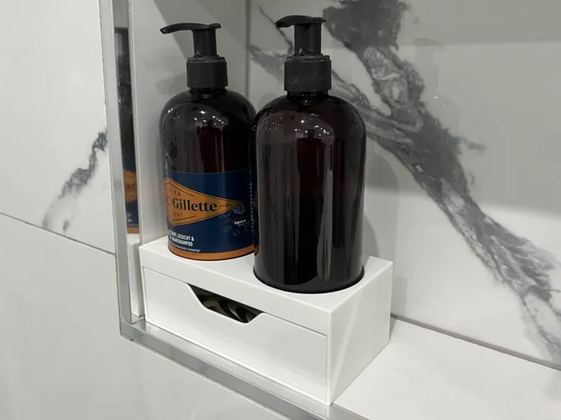 Shampoo holder with a drawer for razors