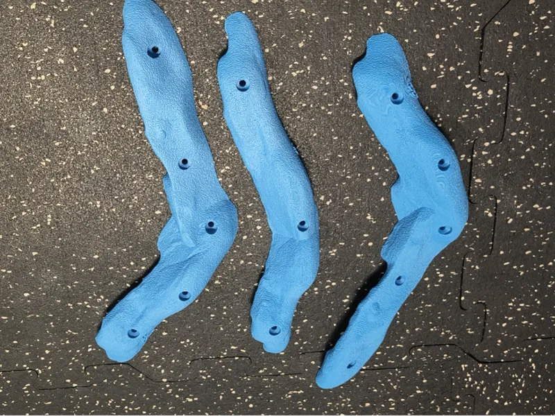 3 Elongated Rock climbing holds with wood screw.