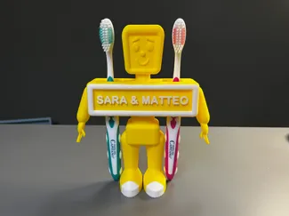 Toy robot toothbrush holder with customizable name