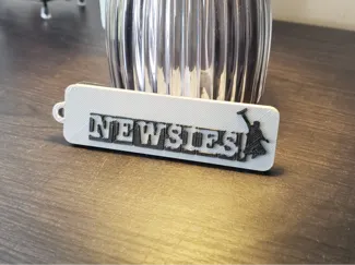 "Newsies!" keychain