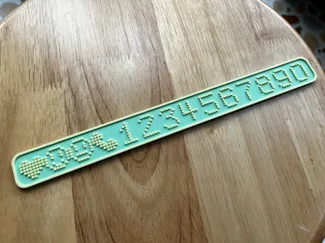 pixel-style phone number plate