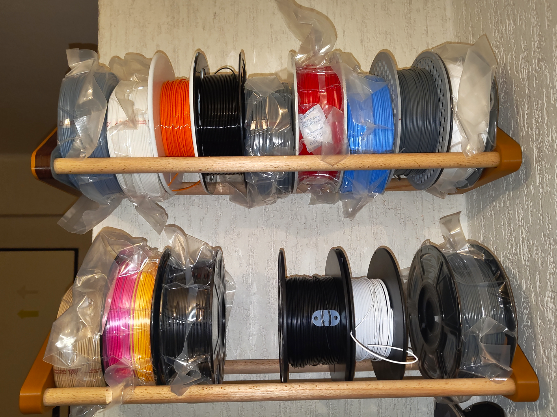 Spool wall storage for 20mm wooden rods