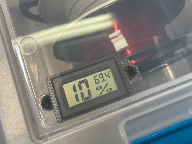 Hygrometer mount for inside of sealed filament bin
