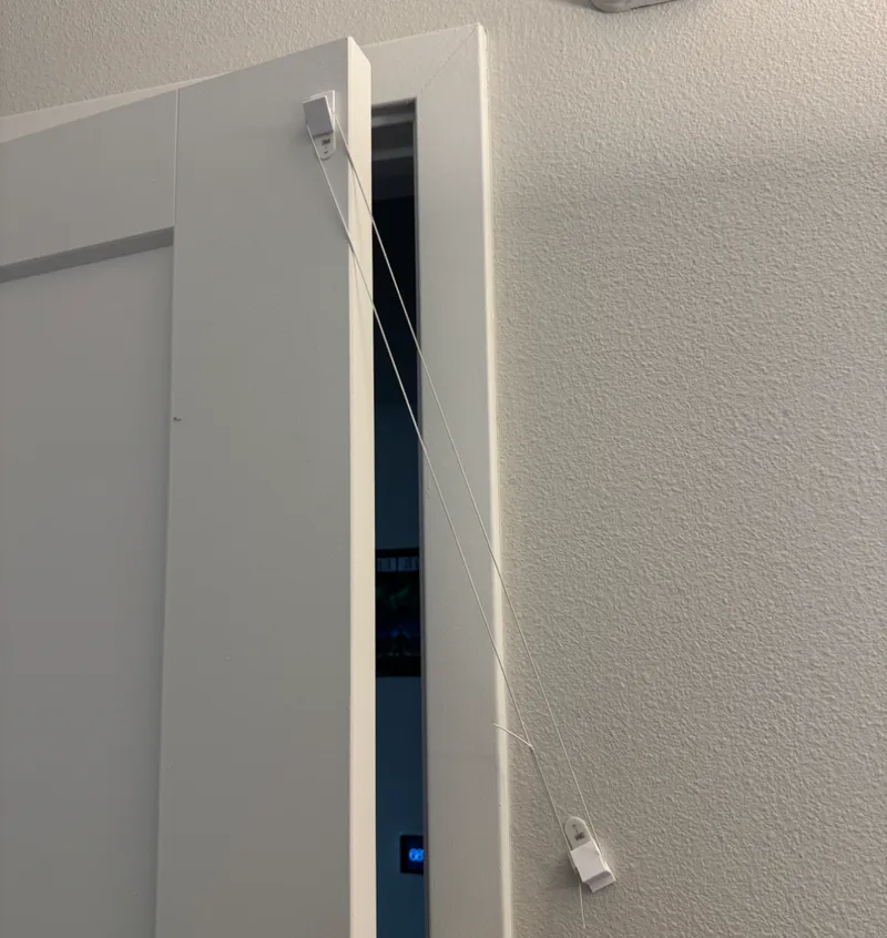 Door Closing Elastic. Works For Cats Too :)