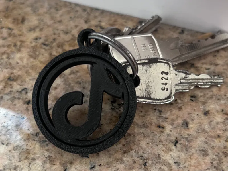 Rotating TikTok logo keychain
