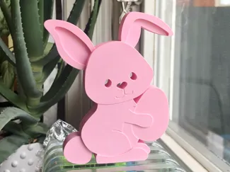 Easter Bunny Holding An Egg - Decoration/Ornament