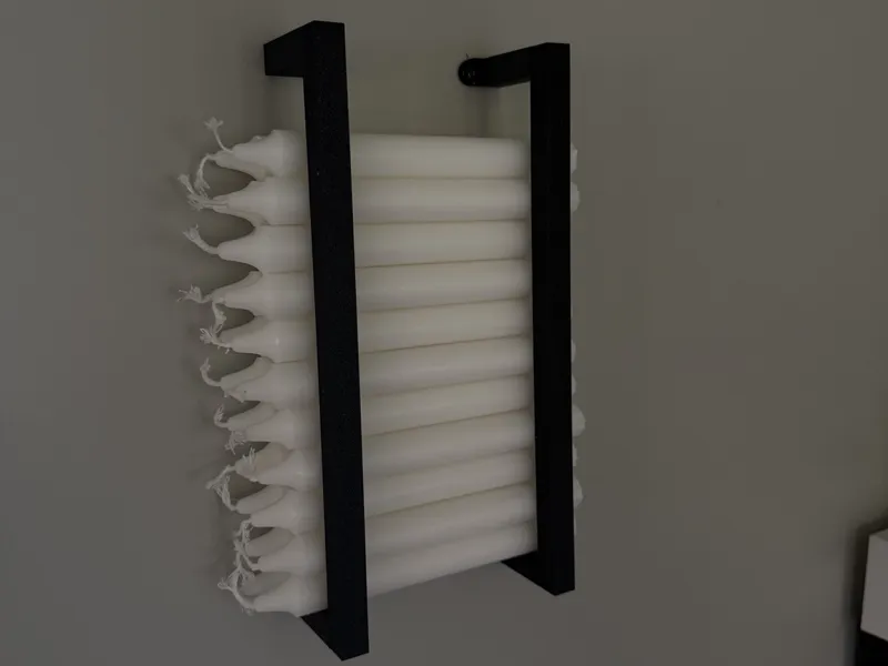 Wall mounted taper candle holder