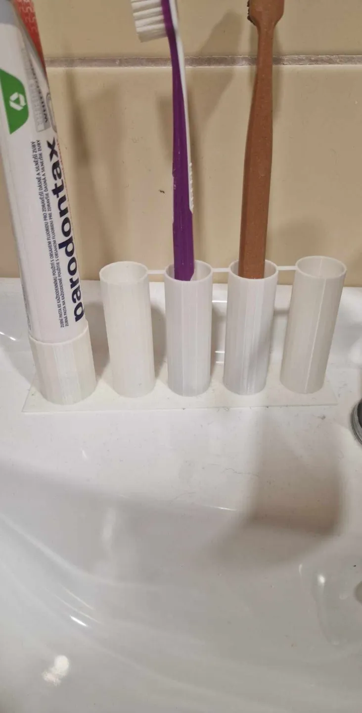 stand for toothbrushes and toothpaste
