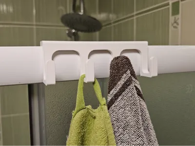 Hanging towel rack for the shower wall