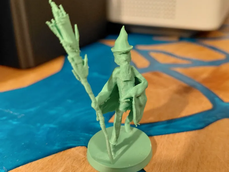 Humanoid wizard miniature with staff