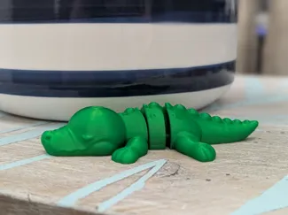 Cute articulated baby crocodile 