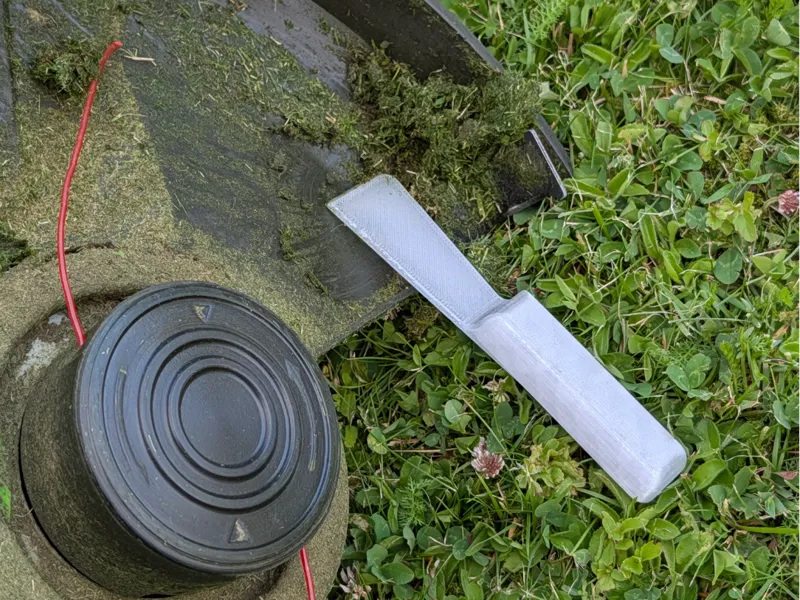 Grass scraper