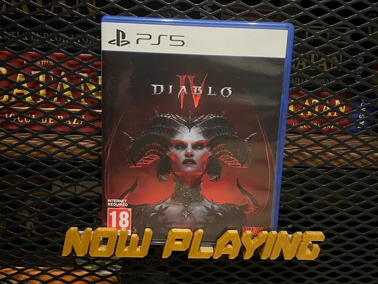 "NOW PLAYING" game/movie stand