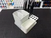 Pen holder with integrated rinse cup