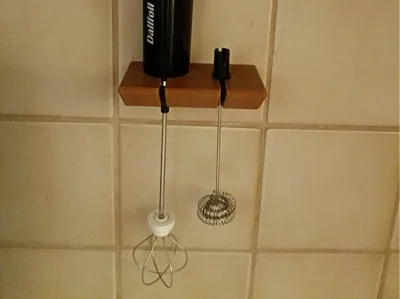 Wall mount for a milk frother